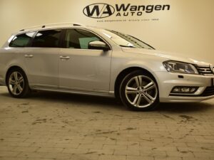 Silver Volkswagen station wagon parked indoors with the name “Wangen Auto” visible in the background.