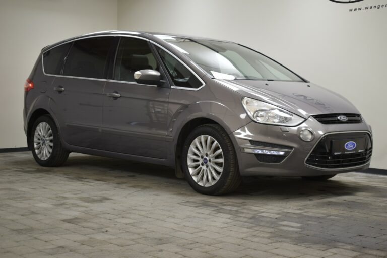 A gray Ford S-MAX parked indoors on a tiled floor.