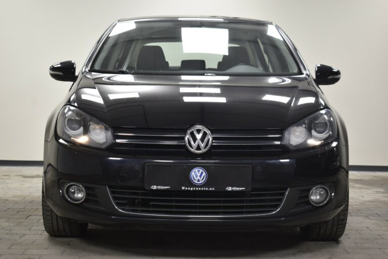 Front view of a black Volkswagen car in a well-lit showroom.