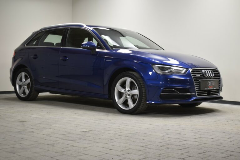 Blue Audi hatchback parked indoors, angled view from the front and side.