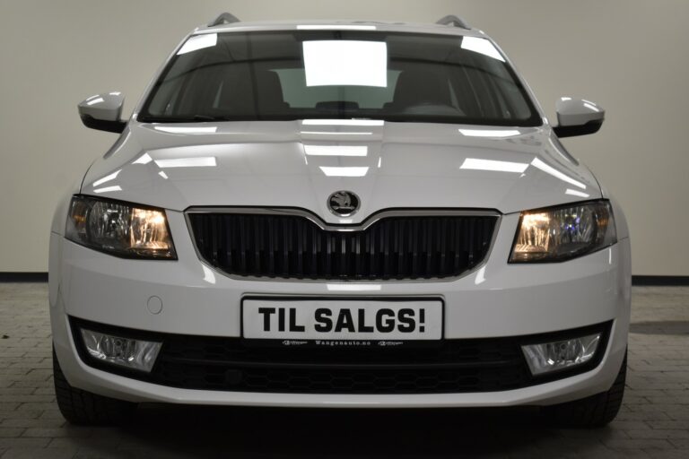 Front view of a white car with a "TIL SALGS!" sign on the license plate, indicating it's for sale.